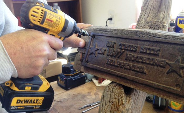 mounted the wood on the old post right above a knot