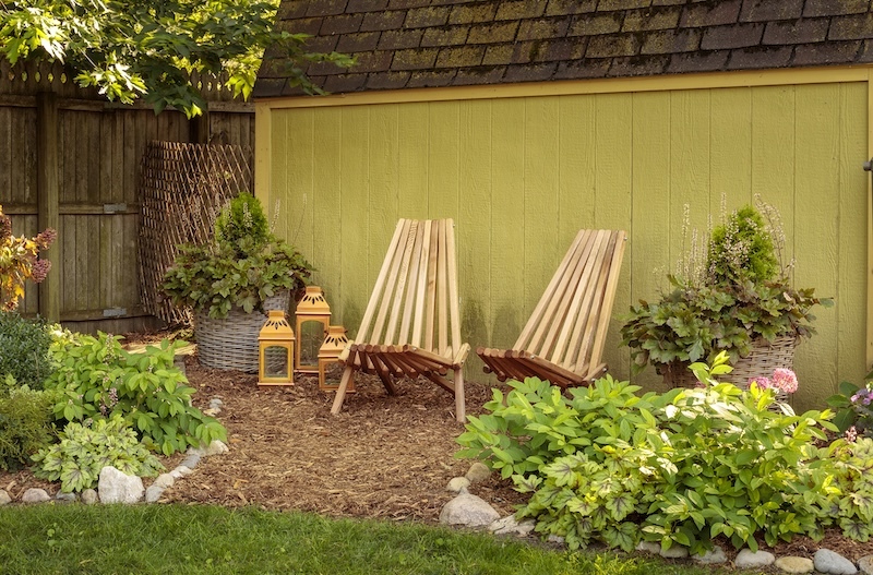 native_garden_seating area with oakleaf hydrangea, inkberry holly, sweetspire, foamy bells, goatsbeard, arborvitae, and smooth hydrangea